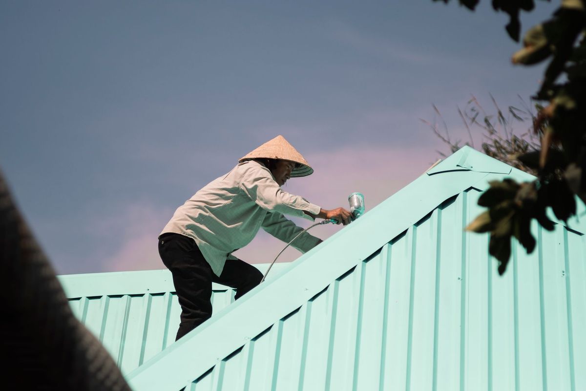 Roof inspector examining a residential roof in Phoenix